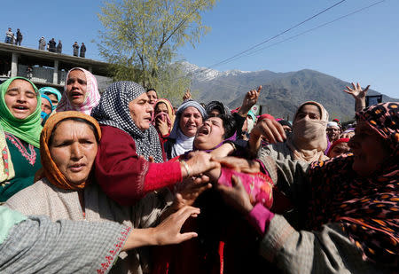 Women wail during the funeral of Umar Farooq, a civilian who was killed on Sunday during a protest against by-polls, in Barsoo village in Ganderbal district in Kashmir April 10, 2017. REUTERS/Danish Ismail