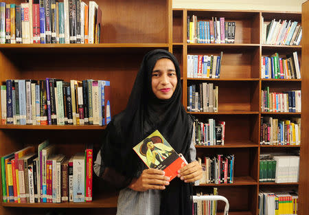 Formin Akter, a Rohingya refugee girl, holds a copy of the novel Jane Eyre, which she says is her new favourite book, inside the library of the Asian University for Women in Chittagong, Bangladesh December 4, 2018. REUTERS/Zeba Siddiqui