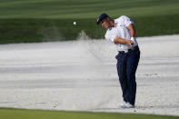 Bryson DeChambeau hits from the bunker on the 14th hole during the third round of The Players Championship golf tournament Saturday, March 13, 2021, in Ponte Vedra Beach, Fla. (AP Photo/John Raoux)