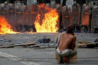 Demonstrators clash with riot security forces at a rally during a strike called to protest against Venezuelan President Nicolas Maduro's government in Caracas, Venezuela July 26, 2017. REUTERS/Carlos Garcia Rawlins