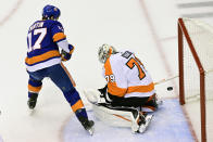 New York Islanders left wing Matt Martin (17) scores against Philadelphia Flyers goaltender Carter Hart (79) during second-period NHL Stanley Cup Eastern Conference playoff hockey game action in Toronto, Saturday, Aug. 29, 2020. (Frank Gunn/The Canadian Press via AP)