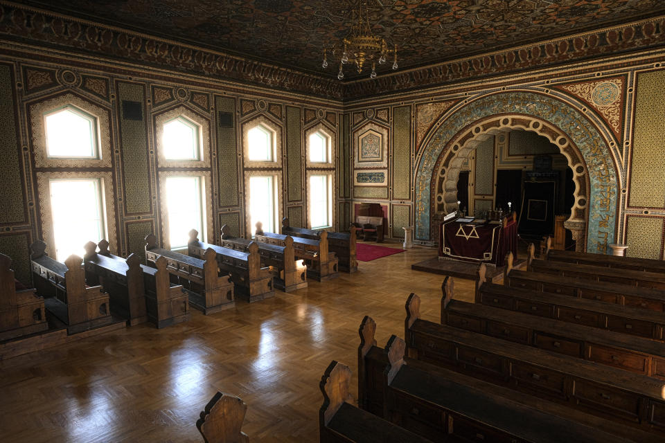 In this Thursday, April 9, 2020 photo the synagogue in Sarajevo, Bosnia, is deserted as worshipers stay away due to the national lockdown the authorities have imposed attempting to limit the spread of the new coronavirus. (AP Photo/Kemal Softic)