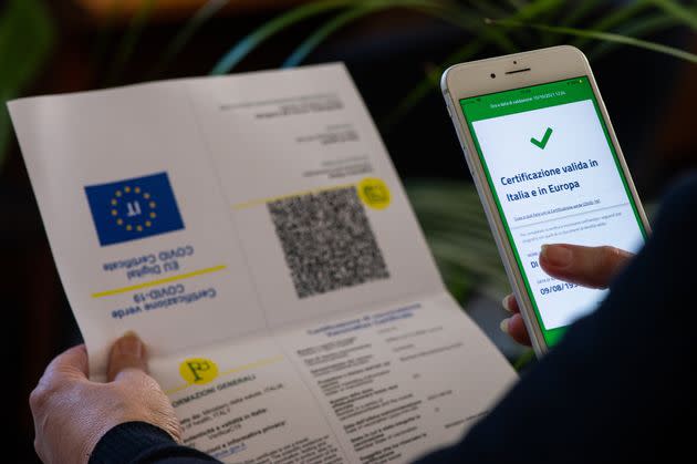 A worker checking green pass certificate in L'Aquila, Italy, on October 15, 2021. On October 15 green card certification becomes mandatory for all workers. (Photo by Lorenzo Di Cola/NurPhoto via Getty Images) (Photo: NurPhoto via Getty Images)