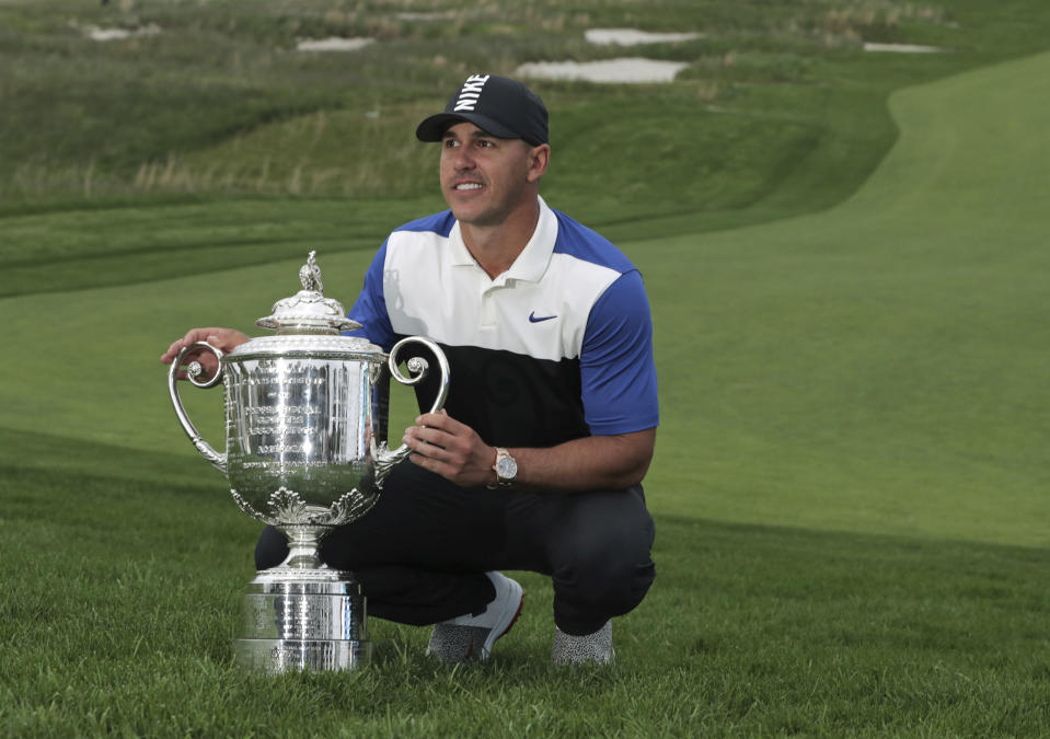 Brooks Koepka poses with the Wanamaker Trophy after winning the PGA Championship golf tournament, Sunday, May 19, 2019, at Bethpage Black in Farmingdale, N.Y. (AP Photo/Charles Krupa)