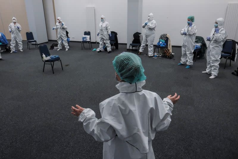 A coronavirus disease (COVID-19) emergency workers train at the international industrial fair in Poznan