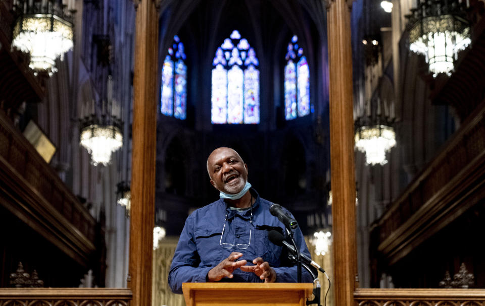 Artist Kerry James Marshall speaks at a news conference after being selected to design a replacement of former Confederate-themed stained glass windows that were taken down in 2017 at the National Cathedral in Washington, Thursday, Sept. 23, 2021. The Cathedral has also commissioned Pulitzer-nominated poet Dr. Elizabeth Alexander to pen a poem that will be inscribed in the stone beneath the new windows. (AP Photo/Andrew Harnik)