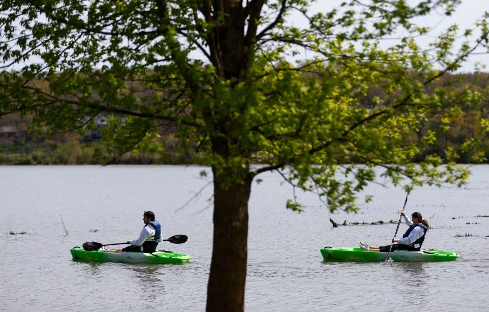 Paul Boeckmann and Megan McVay paddle their rented kayaks in Lake Springfield on Thursday, April 15, 2021. Bass Pro Shops donated more than $27,000 to the Springfield Greene County Park Board to purchase 40 kayaks and for other outdoor initiatives.