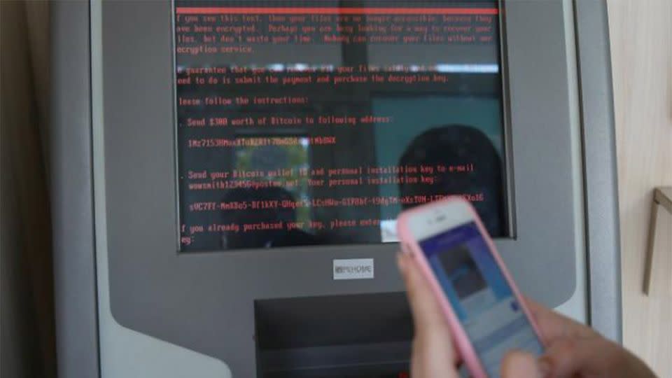 <span class="article-figure-source">A message demanding money is seen on a monitor of a payment terminal at a branch of Ukraine’s state-owned bank Oschadbank. Source: Reuters</span>