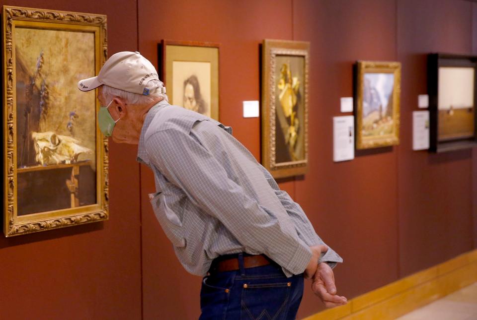 Clinton Cole of Grove looks at "Remains of the Day" by Sherrie McGraw at the 2020 Prix de West Invitational Art Exhibition & Sale at the National Cowboy & Western Heritage Museum in Oklahoma City, Saturday, Aug. 8, 2020.