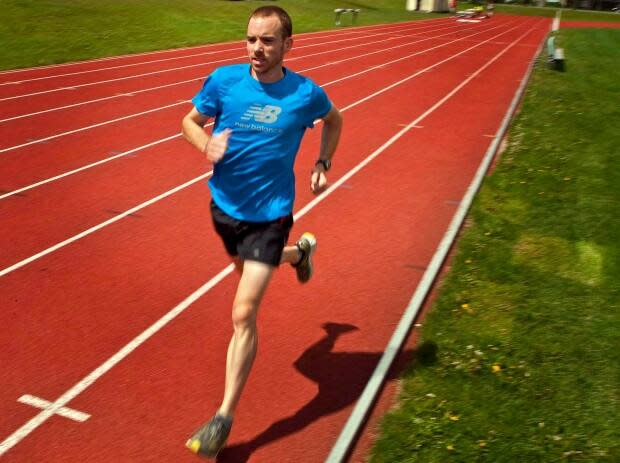 A runner trains at an athletic park in this file photo. The city plans to spend millions bringing new facilities to far corners of Calgary.  (Jeff McIntosh/The Canadian Press - image credit)