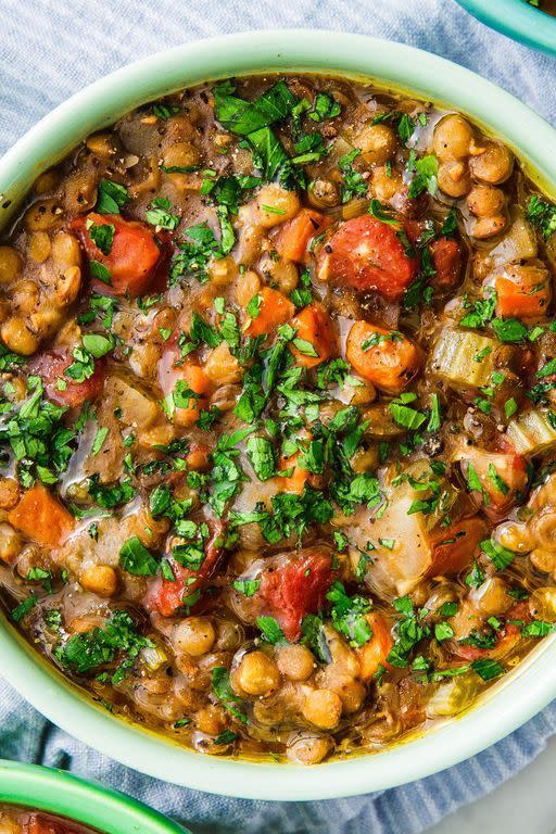 <p>We love lentil soup for its versatility. We add onion, carrot, celery, and garlic as a base, plus canned tomatoes and fresh thyme. Lentil soup of course also needs lentils. The 18 minute wait is the time the lentils take to cook.</p><p>Get the <a href="https://www.delish.com/uk/cooking/recipes/a30130882/instant-pot-lentil-soup/" rel="nofollow noopener" target="_blank" data-ylk="slk:Instant Pot Lentil Soup" class="link rapid-noclick-resp">Instant Pot Lentil Soup</a> recipe.</p>