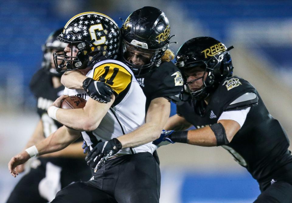 Boyle County's Cole Lanter and  Will Alexander swarmed Johnson Central's Grant Rice in the 4A KHSAA championship game Friday. Dec.3, 2021