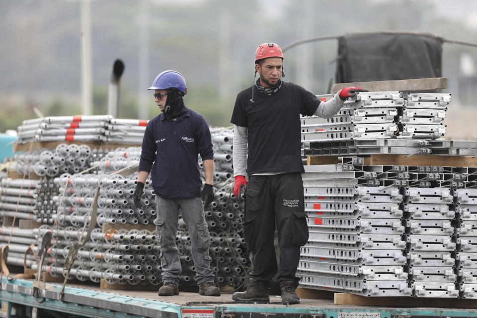 Workers build the stage for the upcoming “Venezuela Aid Live” concert at the Tienditas International Bridge on the outskirts of Cucuta, Colombia, on the border with Venezuela, Monday, Feb. 18, 2019. Billionaire Richard Branson is organizing the concert on Feb. 22 featuring Spanish-French singer Manu Chao, Mexican band Mana, Spanish singer-songwriter Alejandro Sanz and Dominican artist Juan Luis Guerra. (AP Photo/Fernando Vergara)