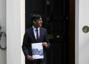 Britain's Chancellor of the Exchequer Rishi Sunak poses for photographers outside No 11 Downing Street, before heading for the House of Commons to give MPs details of his Winter Economy Plan, in London, Thursday Sept. 24, 2020. (AP Photo/Frank Augstein)