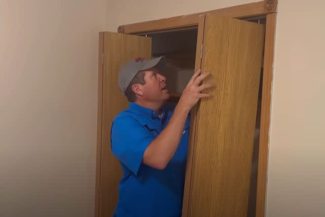 <p>Jana Duggar/YouTube</p> Jim Bob Duggar demonstrating how to remove closet doors