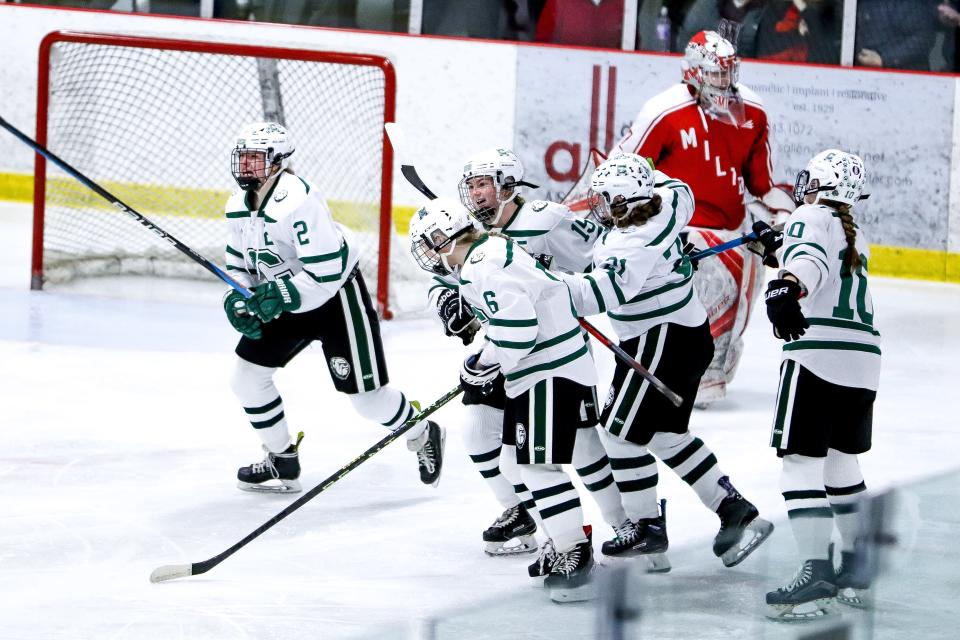 Canton's Lila Spinelli (15) celebrates with teammates after scoring a goal during the Sweet 16 game against Milton in the Div. 2 state tournament at Canton Ice House on Saturday, March 4, 2023.