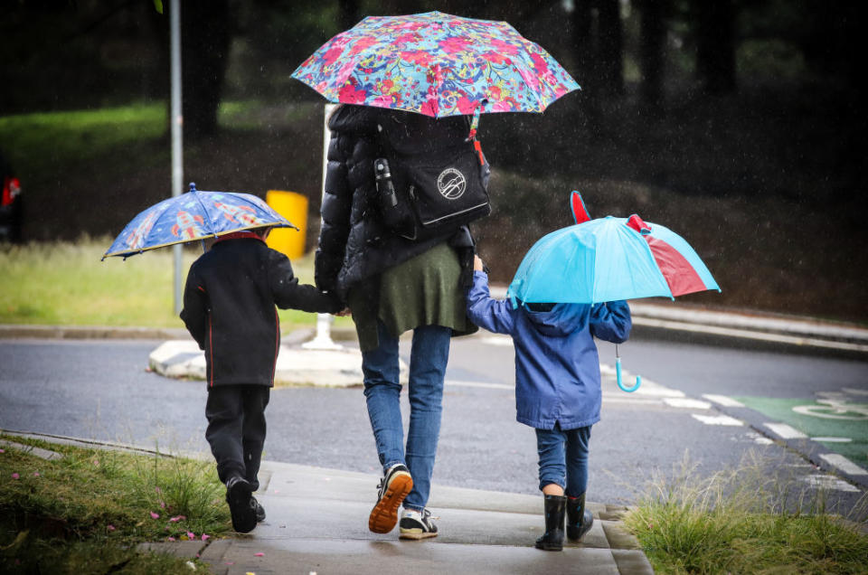 A mum walks her two children to school in Sydney after NSW's first lockdown ended. Source: Getty