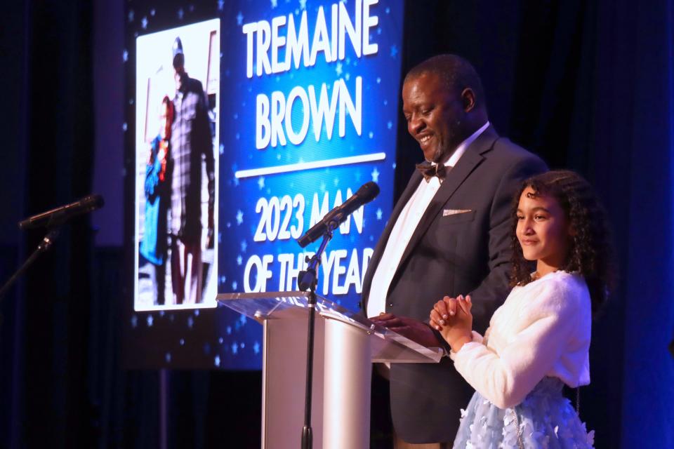 Tremaine Brown accepts the Amarillo Globe-News 2023 Man of the Year award with his daughter Shilah at a ceremony held at the Amarillo Civic Center on Thursday night.