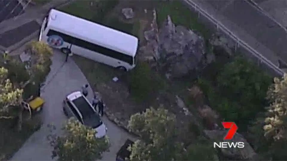 The mini bus dangling off the cliff. Source: 7 News