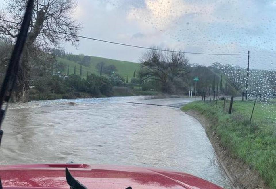 The San Miguel Firefighters Association posted a photo during the storm on Feb. 4, 2024, warning about flooding at low water crossings on San Marcos Road.