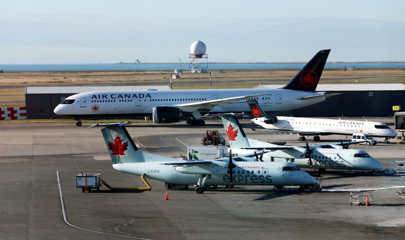 FILE PHOTO: FILE PHOTO: Air Canada airplanes are pictured at Vancouver's international airport in Richmond,