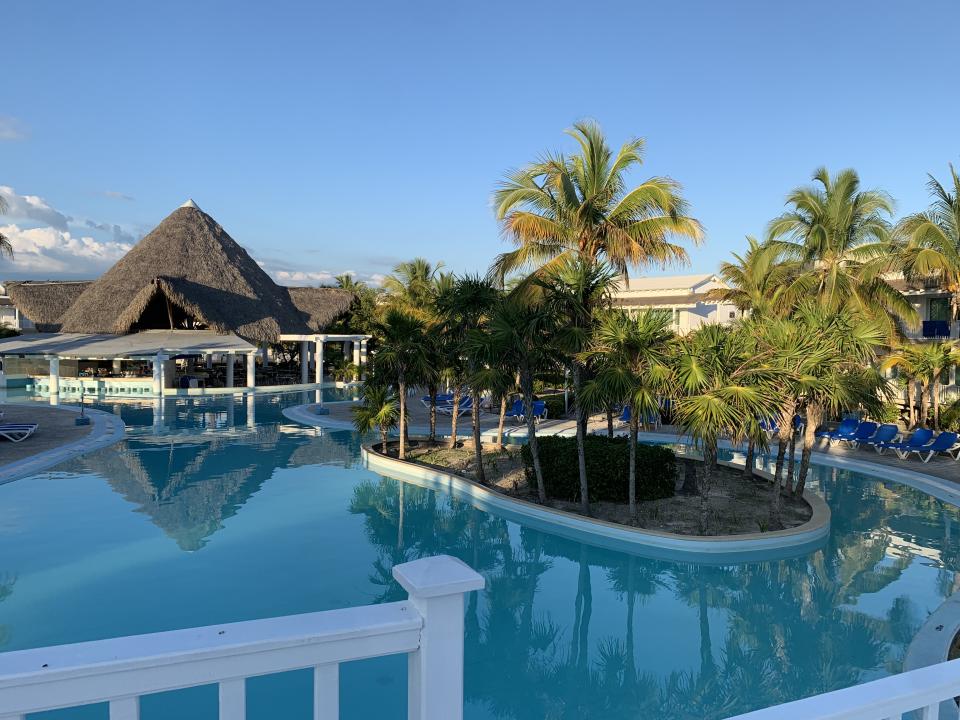 A view of the pool and surrounding palm trees at Memories Cayo Largo in Cayo Largo, Cuba