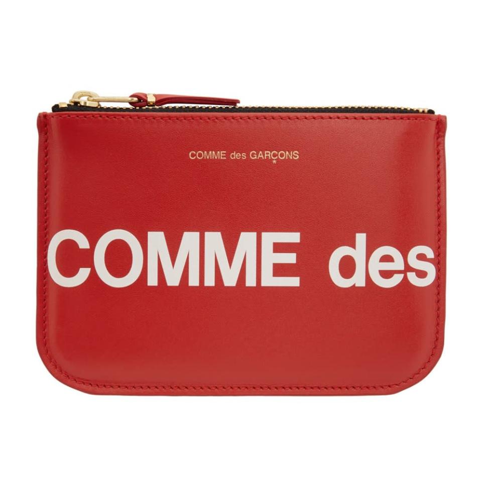This fiery-red Comme des Garçons wallet is the perfect complement to an understated handbag. $170, Ssense. <a href="https://www.ssense.com/en-us/women/product/comme-des-garcons-wallets/red-huge-logo-pouch/6174591" rel="nofollow noopener" target="_blank" data-ylk="slk:Get it now!" class="link ">Get it now!</a>