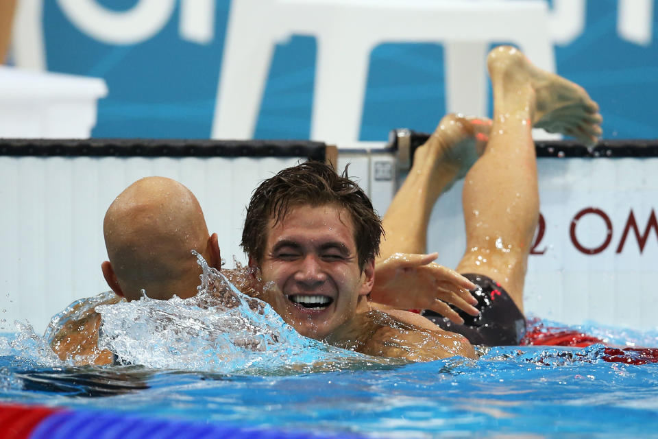 LONDON, ENGLAND - AUGUST 01: Nathan Adrian (R) of the United States is congratulated by Brent Hayden of Canada after Adrian won the Final of the Men's 100m Freestyle on Day 5 of the London 2012 Olympic Games at the Aquatics Centre on August 1, 2012 in London, England. (Photo by Clive Rose/Getty Images)