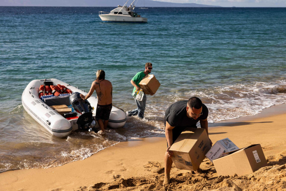 Volunteers unload supplies in Lahaina, Hawaii, on Aug. 12, 2023. (Yuki Iwamura / AFP - Getty Images)