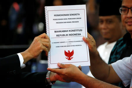 Legal team for Prabowo-Sandi National Campaign Team (R) submit documents for challenging the election result at Indonesia's constitutional court in Jakarta, Indonesia, May 24, 2019. REUTERS/Willy Kurniawan