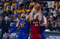 Denver Nuggets guard Jamal Murray, left, and Miami Heat center Cody Zeller (44) compete for possession of the ball during the first half of Game 1 of basketball's NBA Finals, Thursday, June 1, 2023, in Denver. (AP Photo/Jack Dempsey)