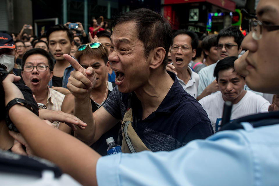 Local residents and pro-government supporters scream at pro-democracy protesters on October 3, 2014 in Mong Kok, Hong Kong. (Chris McGrath/Getty Images)