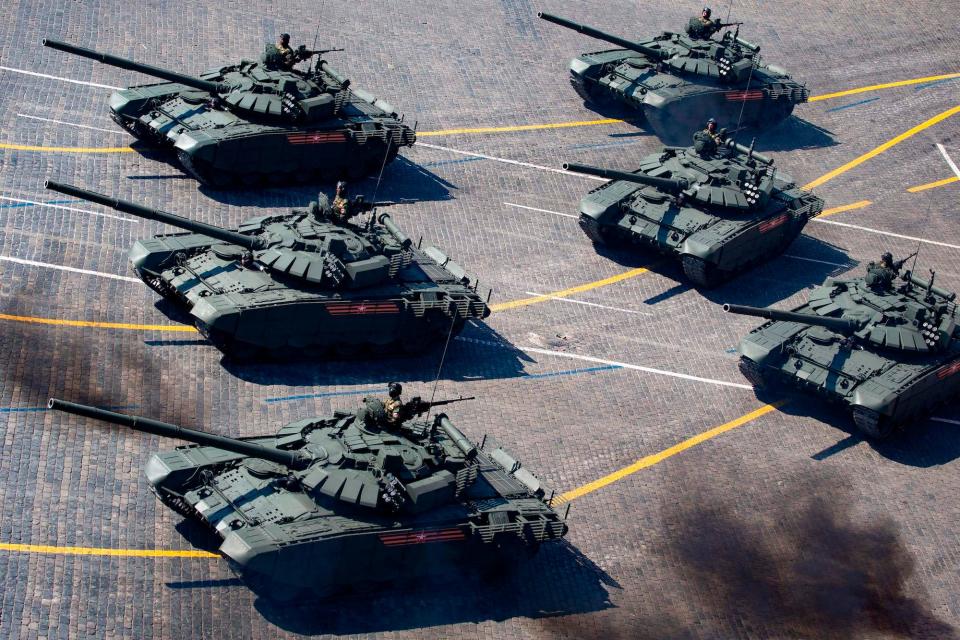 Six tanks moving in unison.