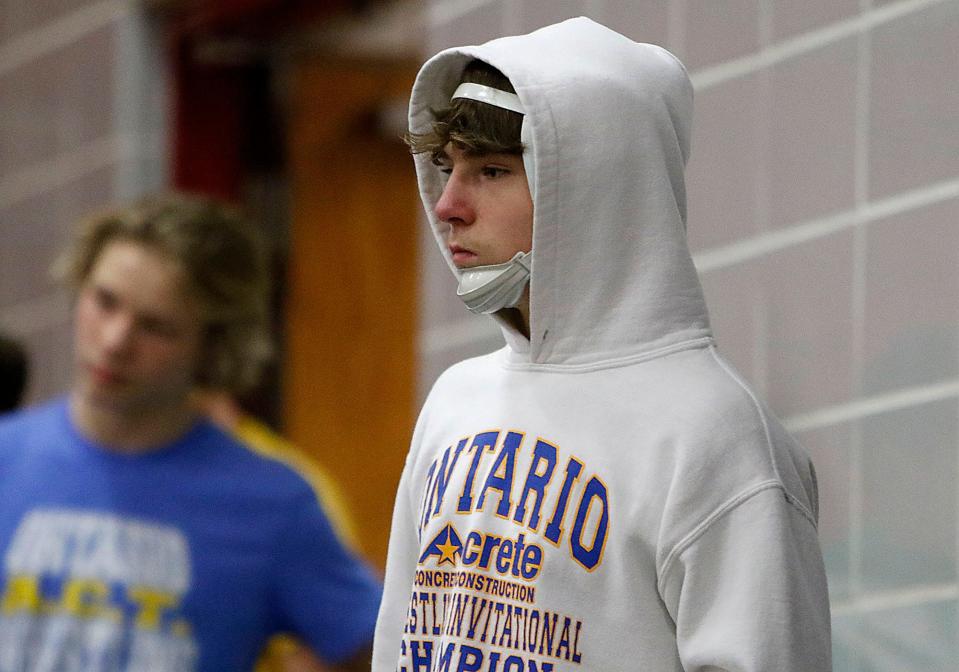 Ontario High School's Jacob Ohl watches a match at the super tri meet Wednesday, Dec. 8, 2021 at Crestview High School. TOM E. PUSKAR/TIMES-GAZETTE.COM