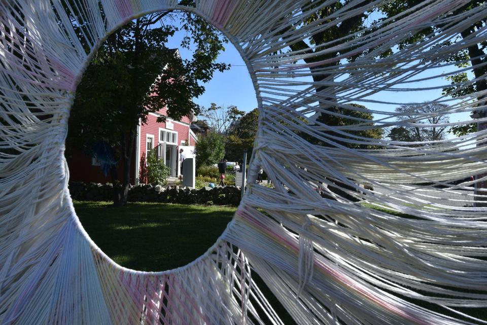 A woven sculpture frames the Guyer Barn Tuesday at the HyArts Campus on South Street in Hyannis where the Cultural Center is partnering with ArtsBarnstable to expand programming there.