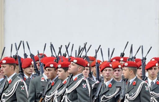 An Austrian honor guard prepares for the arrival of Chinese President Hu Jintao in the courtyard of Hofburg palace. China pledged "active support" to debt-stricken Europe and said it was "convinced" the EU could work through its current debt crisis, as Hu visited Vienna on Monday ahead of a G20 meeting