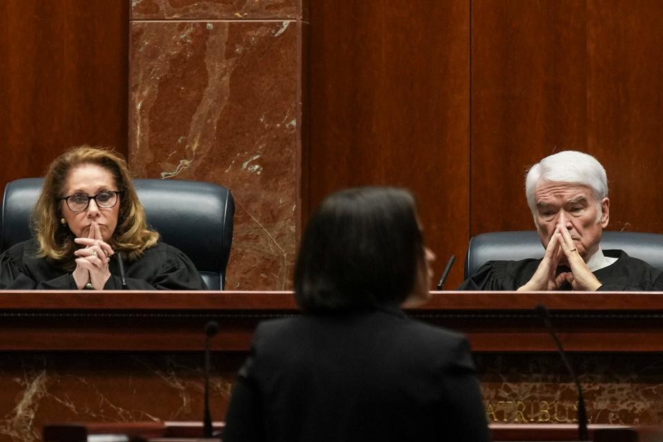 Texas Supreme Court Justice Debra Lehrmann and Chief Justice Nathan L. Hecht listen to Center for Reproductive Rights attorney Molly Duane during Tuesday's arguments.