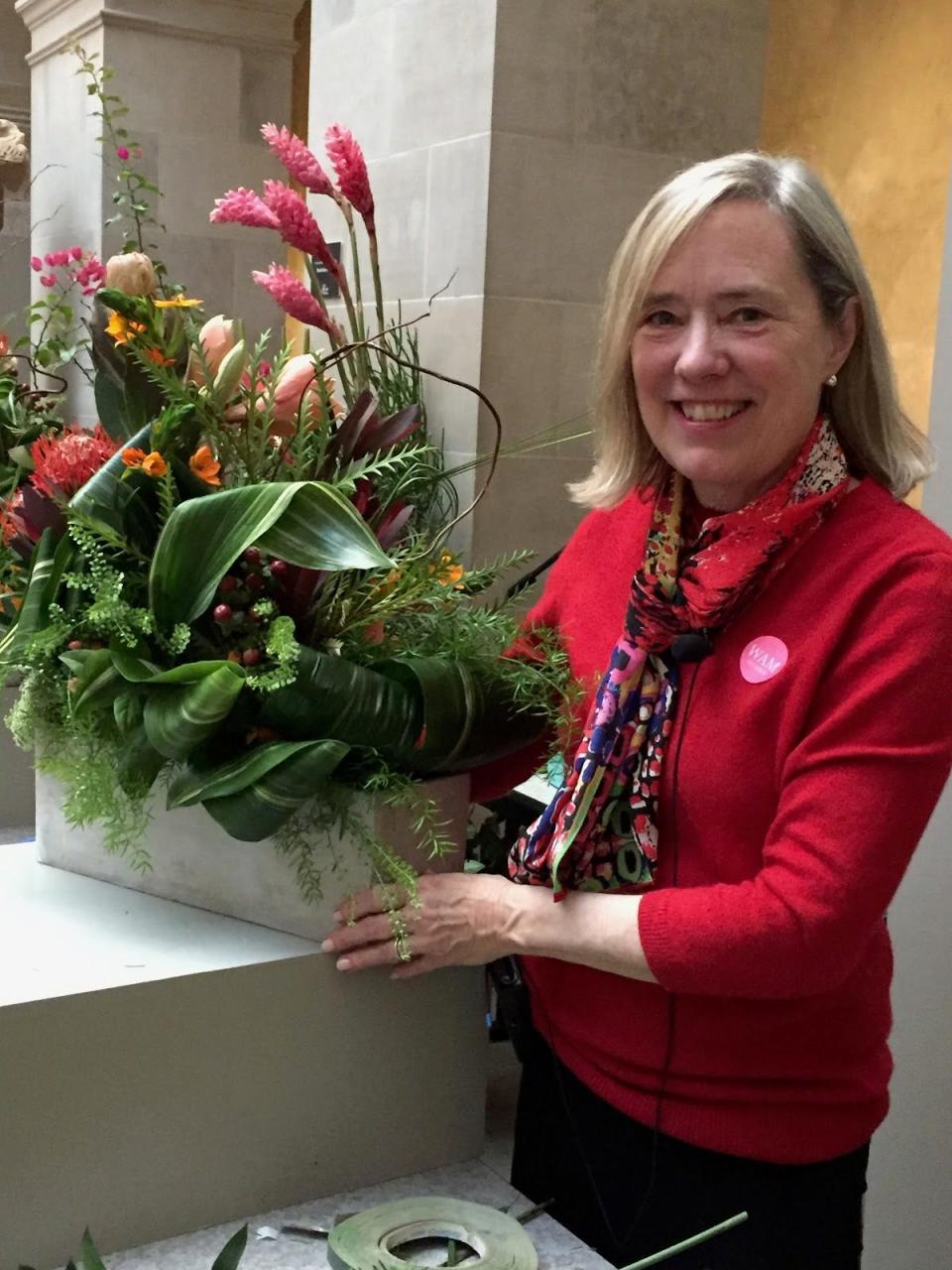 Susan Dewey, the lead arranger for the Osterville Garden Club, is one of the local participants in the "Art in Bloom" exhibit at the Museum of Fine Arts in Boston.