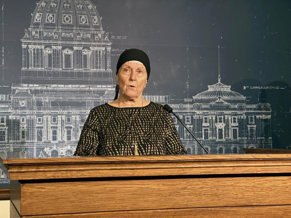 Nancy Unde, of Corcoran, Minn., who was diagnosed with an aggressive form of brain cancer in late 2022, speaks at a news conference about his bill to allow physician-assisted suicide in Minnesota, Thursday, Jan. 25, 2024 at the State Capitol in St. Paul, Minn. Ten states and the District of Columbia already allow some form of physician-assisted suicide, while proponents are planning fresh pushes to pass it this year in several other states. (AP Photo/Steve Karnowski)