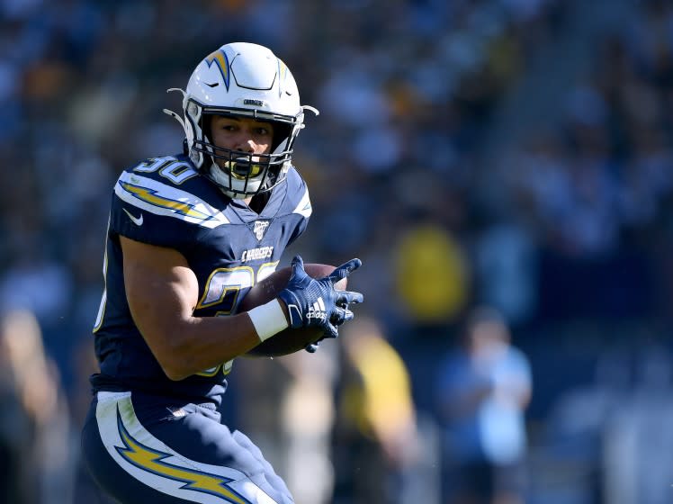 Chargers running back Austin Ekeler makes a catch against the Packers