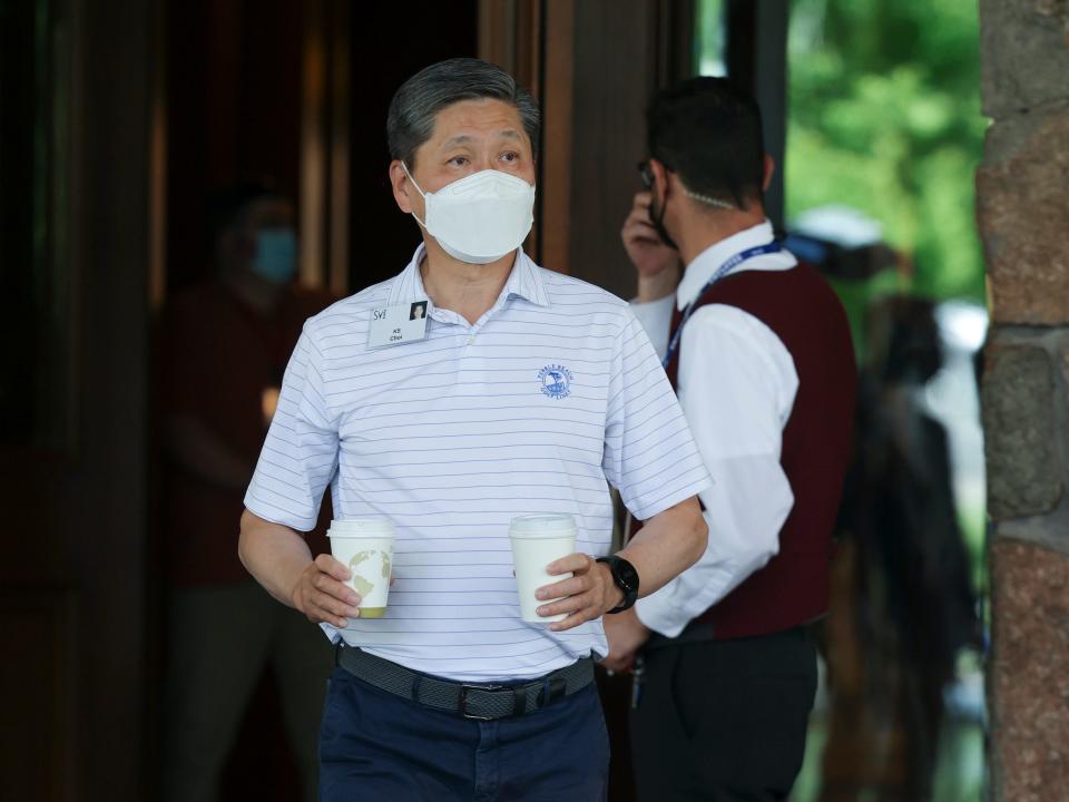 KS Choi, CEO of Samsung North America, holds two coffee cups at Sun Valley conference