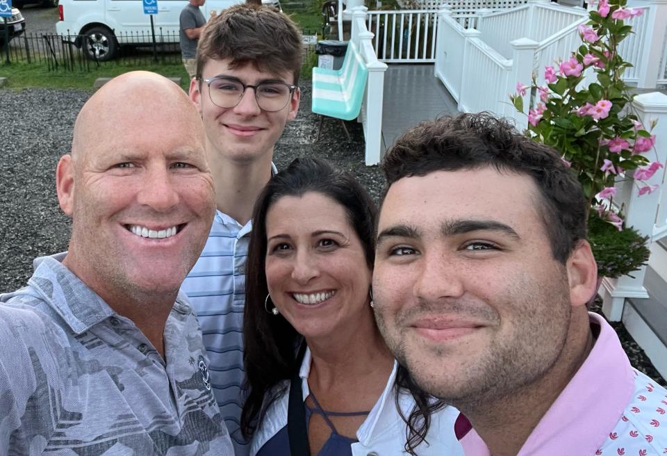 From left, Brendan Hester, his son Owen, wife Marcy and son Jack take a recent family photo.