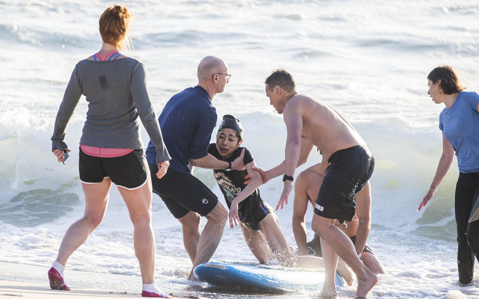 The woman was caught under 10ft waves at Bronte Beach before being saved by Bondi Rescue Lifeguards