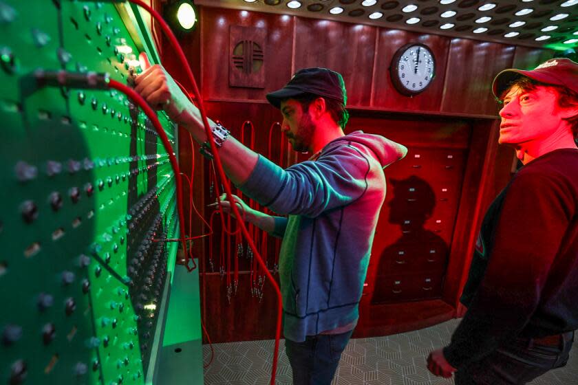 Tommy Wallach, right, and Terry Pettigrew-Rolapp, left, in an escape room.