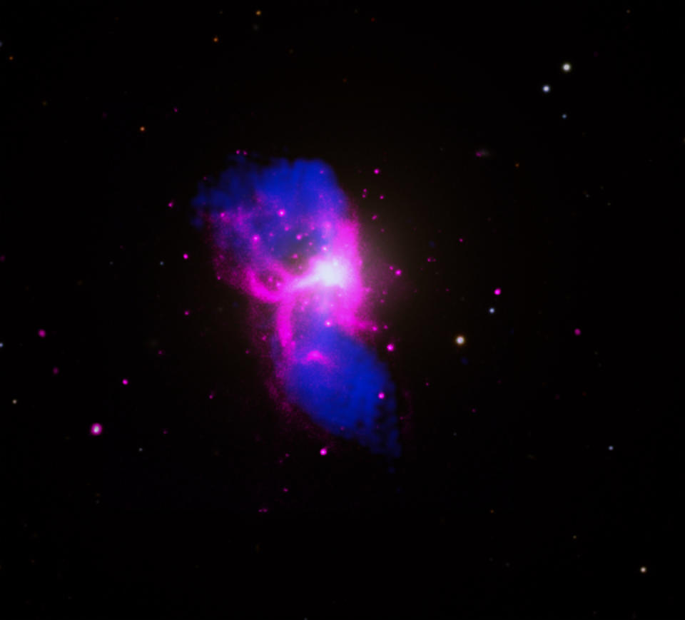 a large purple cloud in space in the shape of the letter 'H'