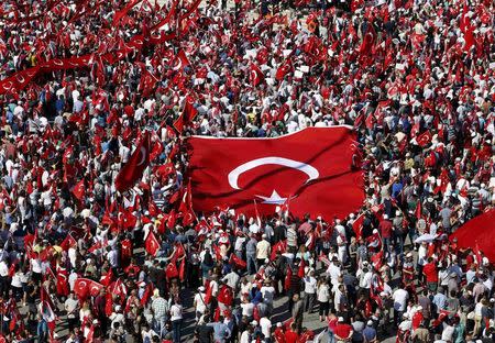 Supporters of various political parties gather in Istanbul's Taksim Square and wave Turkey's national flags before the Republic and Democracy Rally organised by main opposition Republican People's Party (CHP), Turkey, July 24, 2016. REUTERS/Baz Ratner