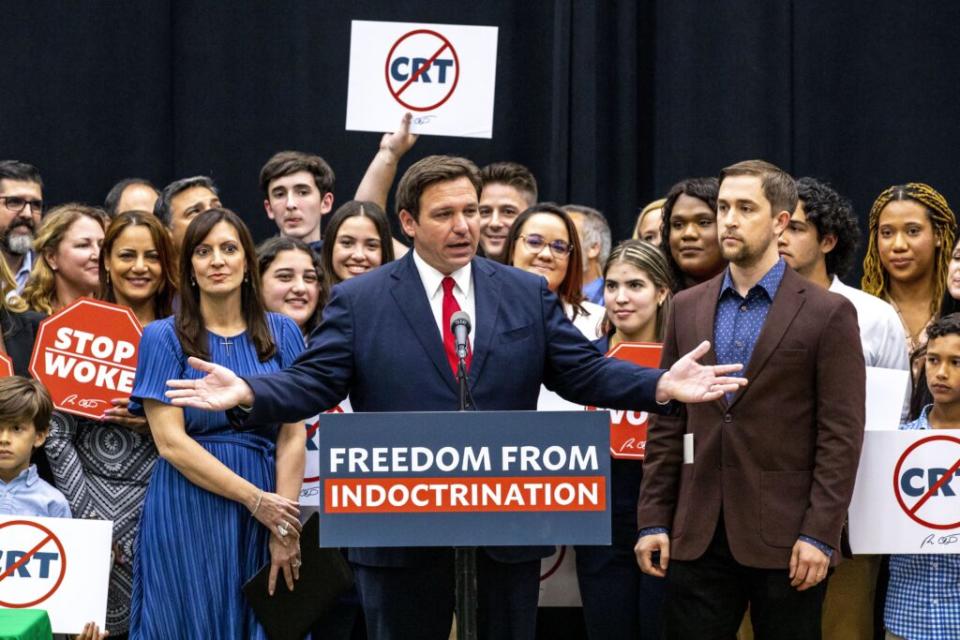 Florida Gov. Ron DeSantis addresses the crowd before publicly signing HB7, “individual freedom,” also dubbed the “stop woke” bill during a news conference at Mater Academy Charter Middle/High School in Hialeah Gardens, Fla., on Friday, April 22, 2022. DeSantis also signed two other bills into laws including one regarding the “big tech” bill signed last year but set aside due to a court ruling, and the special districts bill, which relates to the Reedy Creek Improvement District. (Daniel A. Varela/Miami Herald via AP)