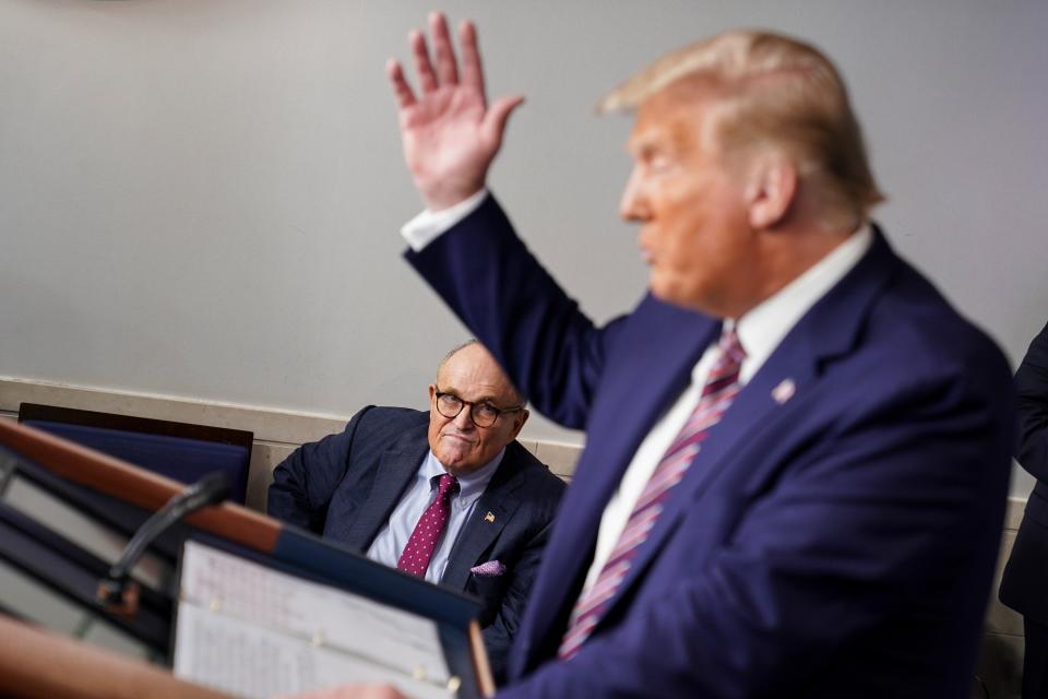 Rudy Giuliani, left, with Donald Trump  (Photo by Joshua Roberts/Getty Images)