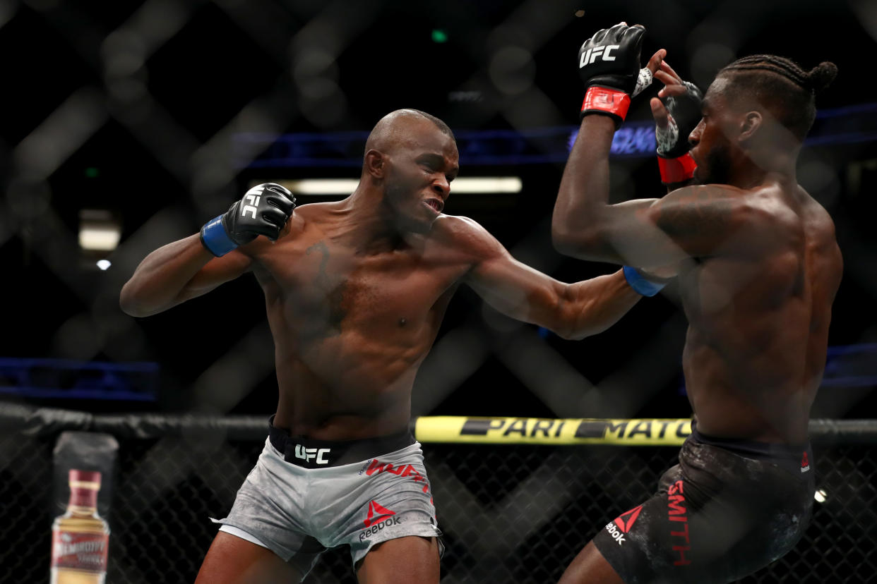 ANAHEIM, CALIFORNIA - AUGUST 17: Khama Worthy throws a punch at Devonte Smith in the first round during their Lightweight Bout at UFC 241 at Honda Center on August 17, 2019 in Anaheim, California. (Photo by Joe Scarnici/Getty Images)