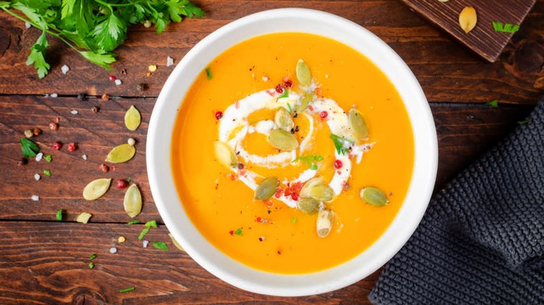 Bowl of pumpkin soup with seeds